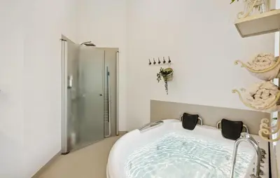 a bath tub in a bathroom with a shower at Gorgeous Home In Farsø With Wifi in Farsø