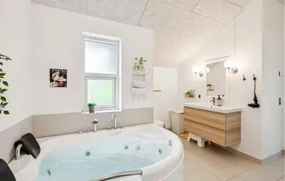 a white bathroom with a tub and a sink at Gorgeous Home In Farsø With Wifi in Farsø
