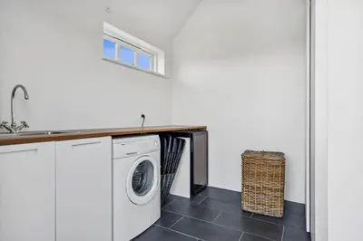 a laundry room with a washing machine and a sink at BL1146-Saltum-Kalundborgvej-25 in Saltum