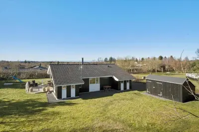a house with a pitched roof and a yard at JB368-Fjerritslev-Ahornvej-38