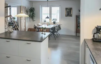 a kitchen and dining room with a table in it at Nice Home In Thyholm With Wifi in Thyholm
