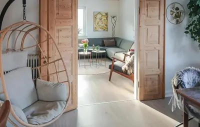 a living room with a chair and a couch at Nice Home In Thyholm With Wifi in Thyholm