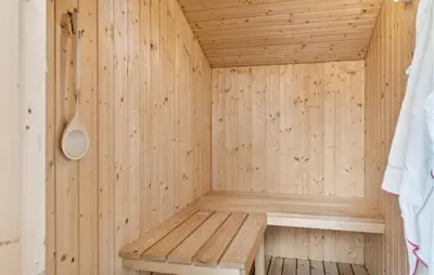 a wooden sauna with a wooden bench in it at Nice Home In Thisted With Sauna in Thisted