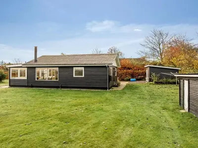 a house with a large yard in front of it at Holiday Home Hjalma - 250m to the fjord by Interhome in Farsø