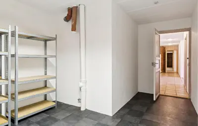 a room with white walls and shelves and a hallway at Gorgeous Home In Lemvig With Wifi in Lemvig