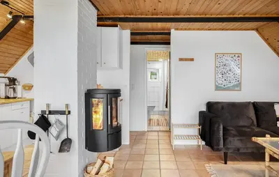 a fireplace in a living room with a couch at 2 Bedroom Pet Friendly Home In Thisted in Thisted
