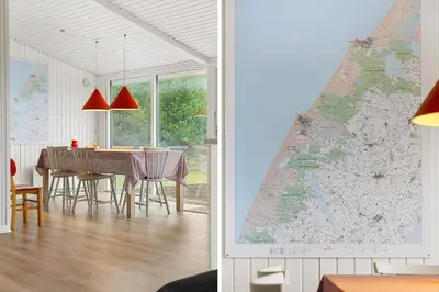a room with a table and a map on the wall at 741-Thisted-Klemsvej-29 in Nørre Vorupør