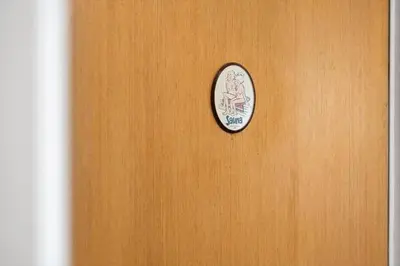 a wooden door with a clock on it at 822-Harboore-Neerlandiavej-138 in Harboør