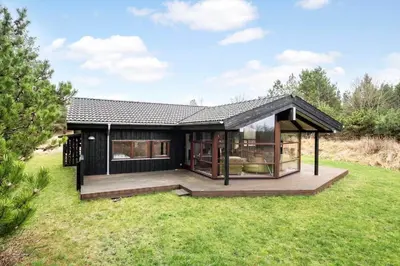 a house with a large deck in a field at JB372-Fjerritslev-Ronnevej-3