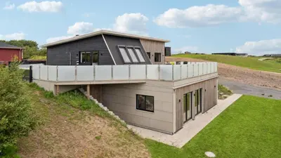 a house on the side of a hill at Villavilla 603 - Hostrup Strand, Limfjorden in Spottrup