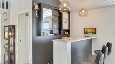 a bar in a room with chairs and a window at Villavilla 476 - Vorupør, Nordjylland in Thisted