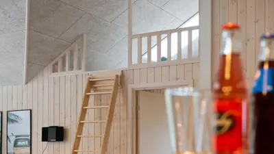 a doll house with a staircase in a room at Villavilla 431 - Hostrup Strand, Limfjorden in Spottrup