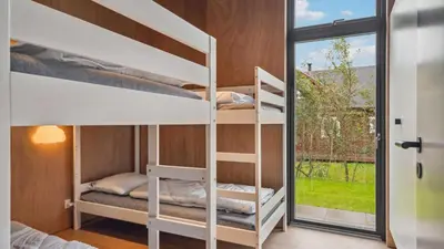 a room with two bunk beds and a window at Villavilla 684 - Virksund, Limfjorden in Højslev