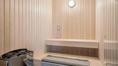 a sauna with a bath tub and a towel at Villavilla 684 - Virksund, Limfjorden in Højslev