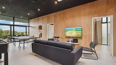 a living room with a couch and a table at Villavilla 684 - Virksund, Limfjorden in Højslev