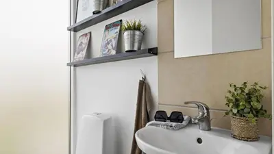 a bathroom with a sink and a white sink at Villavilla 637 - Vorupør, Nordjylland in Snedsted