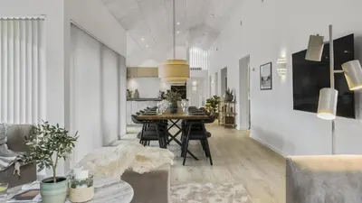 a dining room and kitchen with a table and chairs at Villavilla 683 - Blokhus, Nordjylland in Saltum