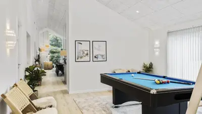 a billiard room with a pool table in the middle at Villavilla 683 - Blokhus, Nordjylland in Saltum