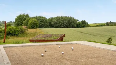 a bunch of white balls sitting on the ground at Villavilla 546 - Hostrup Strand, Limfjorden in Spottrup