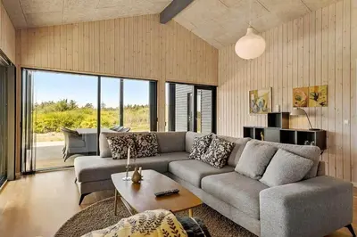 a living room with a couch and a table at BL1150-Saltum-Tolhoj-46 in Saltum