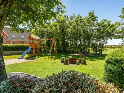 a park with a playground with a slide at Holiday Home Borjana - 500m to the fjord by Interhome in Fur