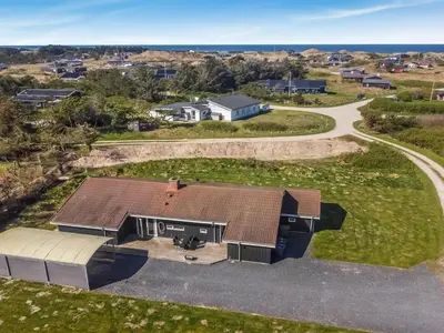 an aerial view of a house with a driveway at Holiday Home Peder - 700m from the sea by Interhome in Løkken