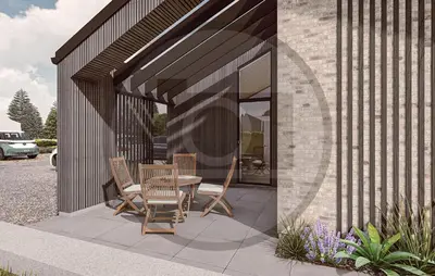 a patio with a table and chairs in a building at Awesome Home In Højslev With Sauna in Højslev