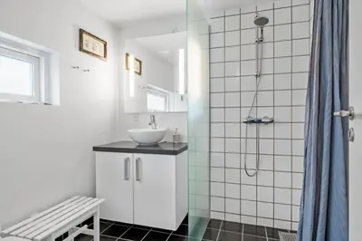 a bathroom with a sink and a shower at JB374-Brovst-Kronvildtvej-222 in Tranum Strand