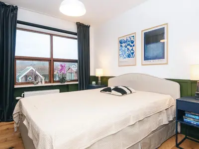 a bedroom with a white bed and a window at 4 star holiday home in Viborg in Viborg