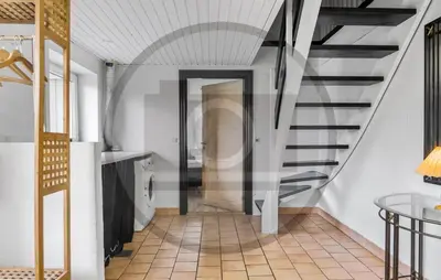 a hallway with a spiral staircase in a house at 2 Bedroom Pet Friendly Home In Øster Assels in Øster Assels
