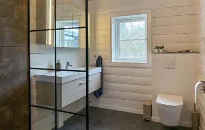 a bathroom with a sink and a toilet at Stunning Home In Løgstør With Sauna in Løgstør