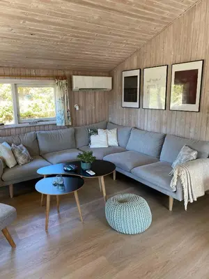 a living room with a couch and tables at Peaceful Base Near Beach And Nature in Saltum