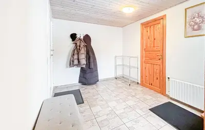 a room with a coat hanging on the wall at Cozy Home In Nykøbing M With Wifi in Tæbring