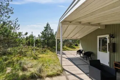 a covered porch of a green house with a wooden roof at 1371-Thisted-Havtornvej-1 in Nørre Vorupør