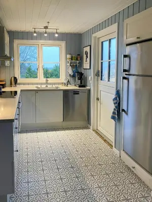 a kitchen with a sink and a refrigerator at Cozy Holiday Home With Fjord Views On Fur in Fur
