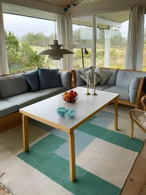 a living room with a couch and a coffee table at Summer House With Views Over Jammerbugt in Saltum