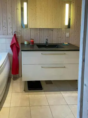 a bathroom with a sink and a bath tub at Summer House With Views Over Jammerbugt in Saltum