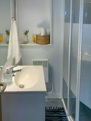 a bathroom with a sink and a shower at Holiday Home By The North Sea Dunes In Rødhus in Pandrup
