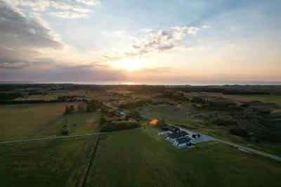 an aerial view of a field with a group of tents at Historic Farm And Surf Shack At Cold Hawaii in Thisted