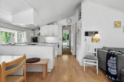 a kitchen and a living room with a table at JB381-Fjerritslev-Ahornvej-65