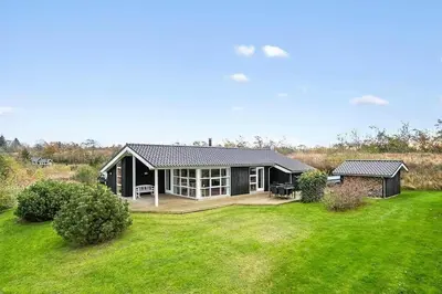 a home with a large yard with a house at JB406-Fjerritslev-Aspevej-68 in Fjerritslev