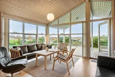 a living room with a couch and a table at JB406-Fjerritslev-Aspevej-68 in Fjerritslev