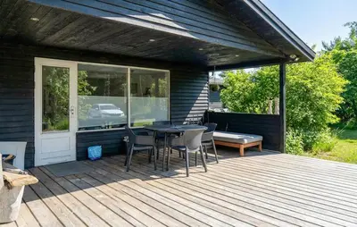 a patio with a table and chairs on a deck at Awesome Home In Erslev With Wifi in Erslev