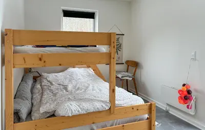 a bedroom with a wooden bunk bed in a room at Awesome Home In Erslev With Wifi in Erslev