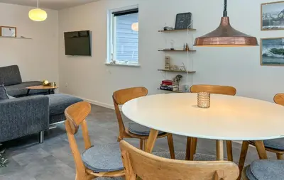 a living room with a table and chairs at Awesome Home In Erslev With Wifi in Erslev