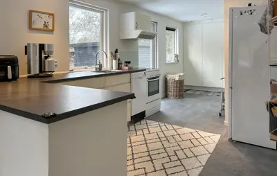 a kitchen with white cabinets and a white refrigerator at Awesome Home In Erslev With Wifi in Erslev