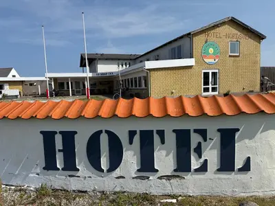 a hotel sign on the side of a building at VØ Budget Drop Inn in Thisted
