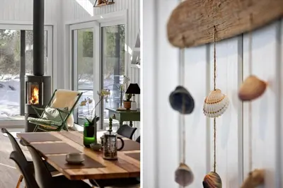 a dining room with a table and a fireplace at JB376-Fjerritslev-Egevej-14