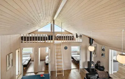 a room with two bunk beds and a living room at Cozy Home In Harboøre With Kitchen in Harboør