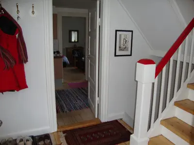 a hallway with a stairway leading up to a home at Klosterpensionen Annex in Viborg